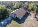 An aerial shot of a lovely house with a paved driveway and verdant surroundings at 3199 Quail Dr, Deltona, FL 32738