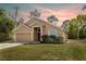 Charming single Gathering home boasts a two-car garage and a well-maintained lawn at 3199 Quail Dr, Deltona, FL 32738