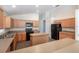 Spacious kitchen with wood cabinets, an island, modern appliances, and plenty of countertop space at 3199 Quail Dr, Deltona, FL 32738