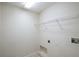 Functional laundry room featuring a wire shelf, utility connections, and neutral-toned walls at 3199 Quail Dr, Deltona, FL 32738