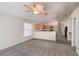 Inviting living room showcasing seamless flow into the kitchen and modern ceiling fan at 3199 Quail Dr, Deltona, FL 32738