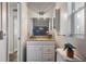 Bathroom vanity with granite counter and decor, alongside a toilet at 3214 Debbie Dr, Orlando, FL 32806