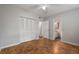 Bedroom featuring wood floors, closet, and access to the bathroom at 3214 Debbie Dr, Orlando, FL 32806