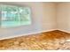 Comfortable bedroom boasting bright natural light and wood flooring at 3214 Debbie Dr, Orlando, FL 32806