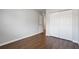 Bedroom with wood floors, closet and access to other rooms at 3214 Debbie Dr, Orlando, FL 32806