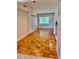 Bright dining room showcasing charming wood floors and a window at 3214 Debbie Dr, Orlando, FL 32806