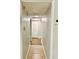 Long hallway with tile flooring and views into other rooms at 3214 Debbie Dr, Orlando, FL 32806