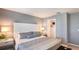 Cozy bedroom with a plush bed, complemented by a walk-in closet and soft, neutral tones at 3550 Mayfair St, Kissimmee, FL 34758