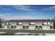 New townhome construction featuring a stylish exterior with modern design elements and well-maintained landscaping at 3550 Mayfair St, Kissimmee, FL 34758