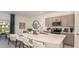 Modern kitchen with stainless steel appliances, a center island, and stylish pendant lighting at 3550 Mayfair St, Kissimmee, FL 34758