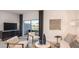 Cozy living room with lake views, stylish decor, and modern media console, perfect for relaxing at 3550 Mayfair St, Kissimmee, FL 34758