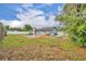 Expansive backyard featuring a pool, patio, and lush lawn at 397 Oslo Dr, Deltona, FL 32725