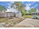 Spacious backyard with storage shed and brick fire pit at 397 Oslo Dr, Deltona, FL 32725