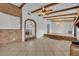 Spacious living room featuring unique brick accents, tile floors, and modern lighting at 397 Oslo Dr, Deltona, FL 32725