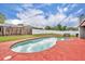 Sparkling pool in a backyard oasis with lounge seating at 397 Oslo Dr, Deltona, FL 32725