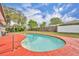 Backyard pool surrounded by lush greenery and privacy fences at 397 Oslo Dr, Deltona, FL 32725