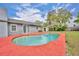Backyard pool with covered lanai and well-manicured lawn at 397 Oslo Dr, Deltona, FL 32725