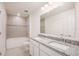 Bathroom features dual sinks, granite countertops, and a tiled shower/tub combination at 4152 Sagefield Dr, Harmony, FL 34773
