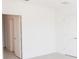 Neutral bedroom with white walls and tile flooring, showcasing a blank canvas ready for personalization at 4152 Sagefield Dr, Harmony, FL 34773