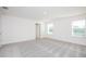 Neutral bedroom with plush carpet, light-filled windows, and plenty of space at 4152 Sagefield Dr, Harmony, FL 34773