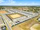 Scenic aerial view highlighting a residential area with neatly arranged homes, green spaces, and recreational facilities on a sunny day at 4210 Lana Ave, Davenport, FL 33897