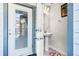 Half bath with single pedestal sink and tile flooring near entry door at 4210 Lana Ave, Davenport, FL 33897