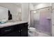 Bathroom features include a shower and dark cabinets with granite countertops at 4210 Lana Ave, Davenport, FL 33897