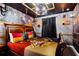 Themed bedroom with brick accent wall, character wall art, and ceiling with dark wood trim at 4210 Lana Ave, Davenport, FL 33897