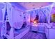 Charming bedroom featuring bunk beds, sheer curtains, and Frozen themed décor at 4210 Lana Ave, Davenport, FL 33897