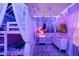 Themed bedroom featuring unique lighting, a bunk bed with white curtains and a Disney themed wall at 4210 Lana Ave, Davenport, FL 33897