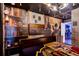 Themed bedroom showcasing a brick accent wall, character art, and bookself wallpaper at 4210 Lana Ave, Davenport, FL 33897