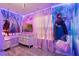 Frozen themed bedroom featuring a vanity, sheer curtains, and a Disney themed wall at 4210 Lana Ave, Davenport, FL 33897