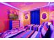 Minions themed bedroom featuring custom lighting, two twin beds, and colorful decor at 4210 Lana Ave, Davenport, FL 33897