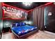 Themed bedroom featuring a starry ceiling, a space themed bedset, and a STAR WARS wall at 4210 Lana Ave, Davenport, FL 33897