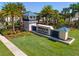 Elegant resort entrance sign surrounded by palm trees and lush landscaping at 4210 Lana Ave, Davenport, FL 33897