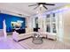 Bright living room featuring a stylish white sectional, decorative pillows, modern accents, and large sliding glass doors at 4210 Lana Ave, Davenport, FL 33897