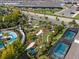 Aerial view of mini golf with palm trees and screened pools in a resort community at 4210 Lana Ave, Davenport, FL 33897