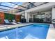 Beautiful pool deck featuring an in-ground pool, lounge chairs, and shaded outdoor dining area at 4210 Lana Ave, Davenport, FL 33897