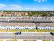 Street view of newly constructed townhomes featuring sidewalks and landscaping at 4210 Lana Ave, Davenport, FL 33897