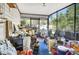 Enclosed back porch with abundant storage and yard equipment with views of the driveway at 4482 Se 142Nd St, Summerfield, FL 34491