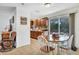 Bright dining area with table, chairs, and sliding glass doors leading to the outside at 4482 Se 142Nd St, Summerfield, FL 34491