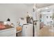 Functional laundry room featuring washer, dryer, and additional storage space at 4482 Se 142Nd St, Summerfield, FL 34491