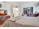 Cozy main bedroom with a comfortable bed and ample closet space at 4482 Se 142Nd St, Summerfield, FL 34491