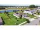 An aerial view of the home with a well-manicured lawn and a private conservation view at 4672 Marina Row Dr, Orlando, FL 32820