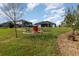Lush backyard with pavers, outdoor seating, water views, and solar panels on the roof at 4672 Marina Row Dr, Orlando, FL 32820