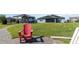 Relaxing backyard view with green grass, solar panels, and a covered gazebo-style area at 4672 Marina Row Dr, Orlando, FL 32820