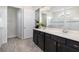 Bathroom features double sinks, white countertops, and a glass-enclosed shower at 4672 Marina Row Dr, Orlando, FL 32820