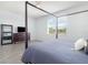 Bedroom boasting a large bed with wood floors at 4672 Marina Row Dr, Orlando, FL 32820