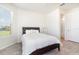 Cozy bedroom with a queen bed, white linens, light grey floors, and a bright window at 4672 Marina Row Dr, Orlando, FL 32820