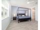 Bedroom boasts a large bed with wood floors and a ceiling fan at 4672 Marina Row Dr, Orlando, FL 32820